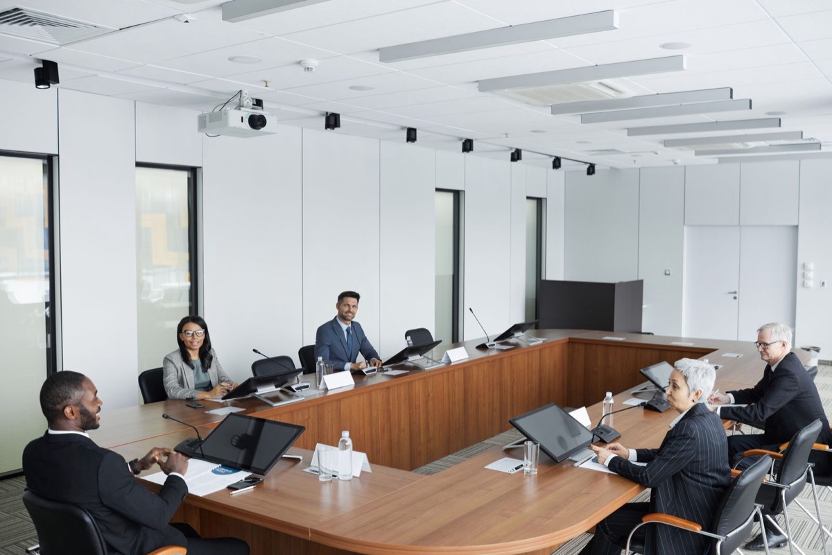 Multi-location business team reviewing operating procedures